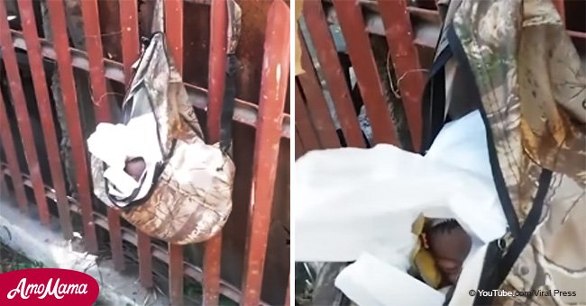 Bebé recién nacido hallado colgado de una cerca en un bolsa tras ser 'abandonado por joven mamá'
