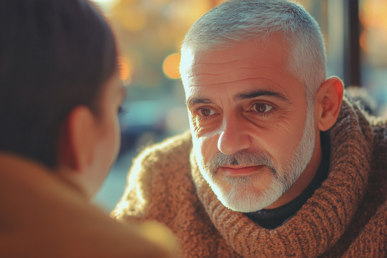 Un hombre mirando a una mujer | Fuente: Midjourney