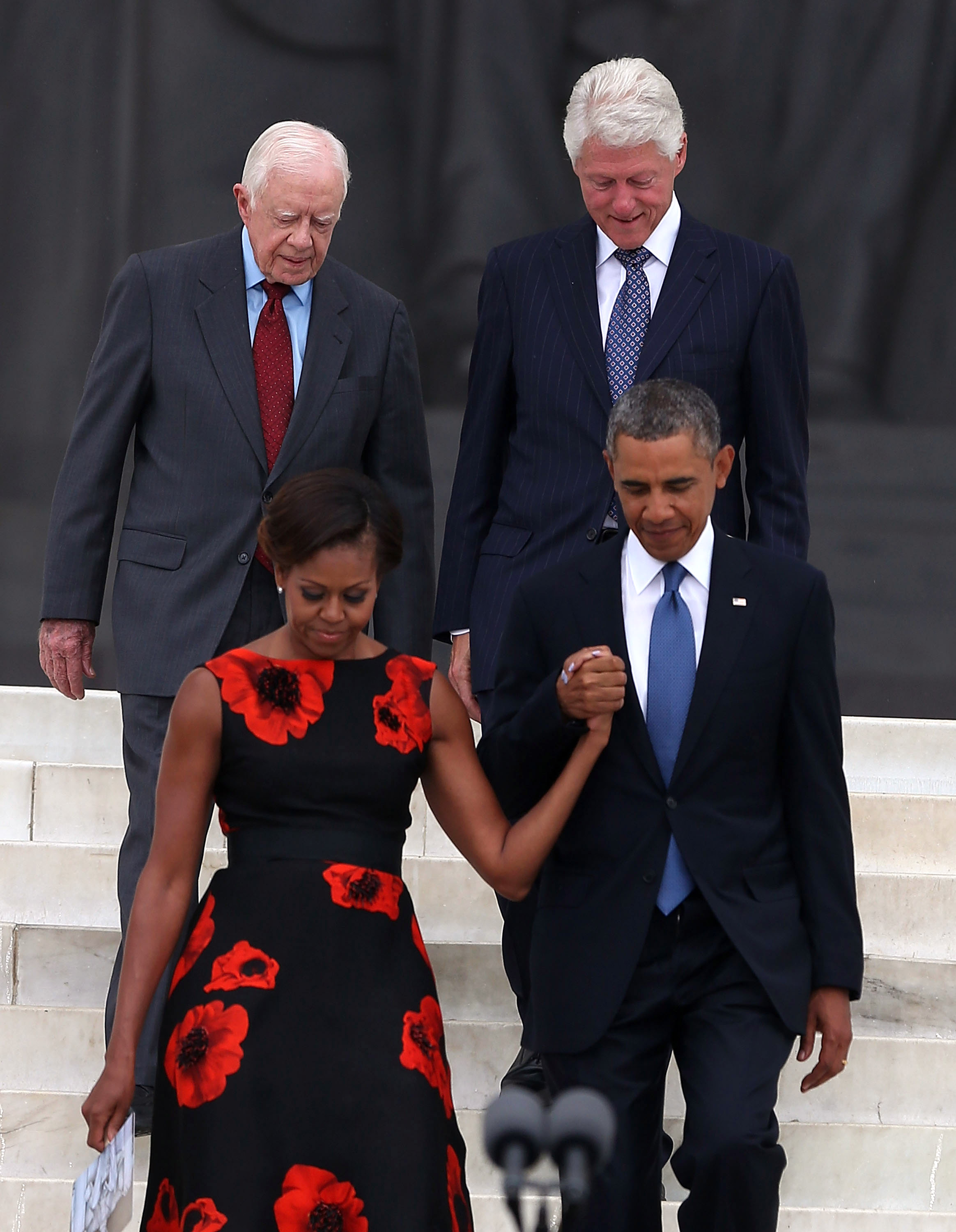 Jimmy Carter y Bill Clinton fotografiados con Michelle y Barack Obama el 28 de agosto de 2013, en Washington, D.C. | Fuente: Getty Images