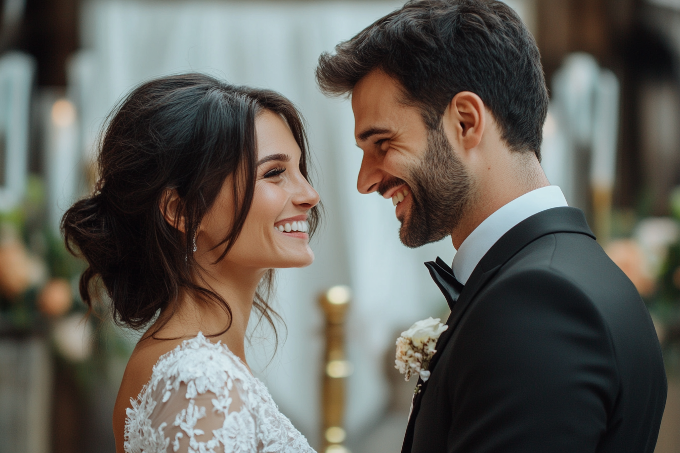 Una pareja riendo juntos el día de su boda | Fuente: Midjourney