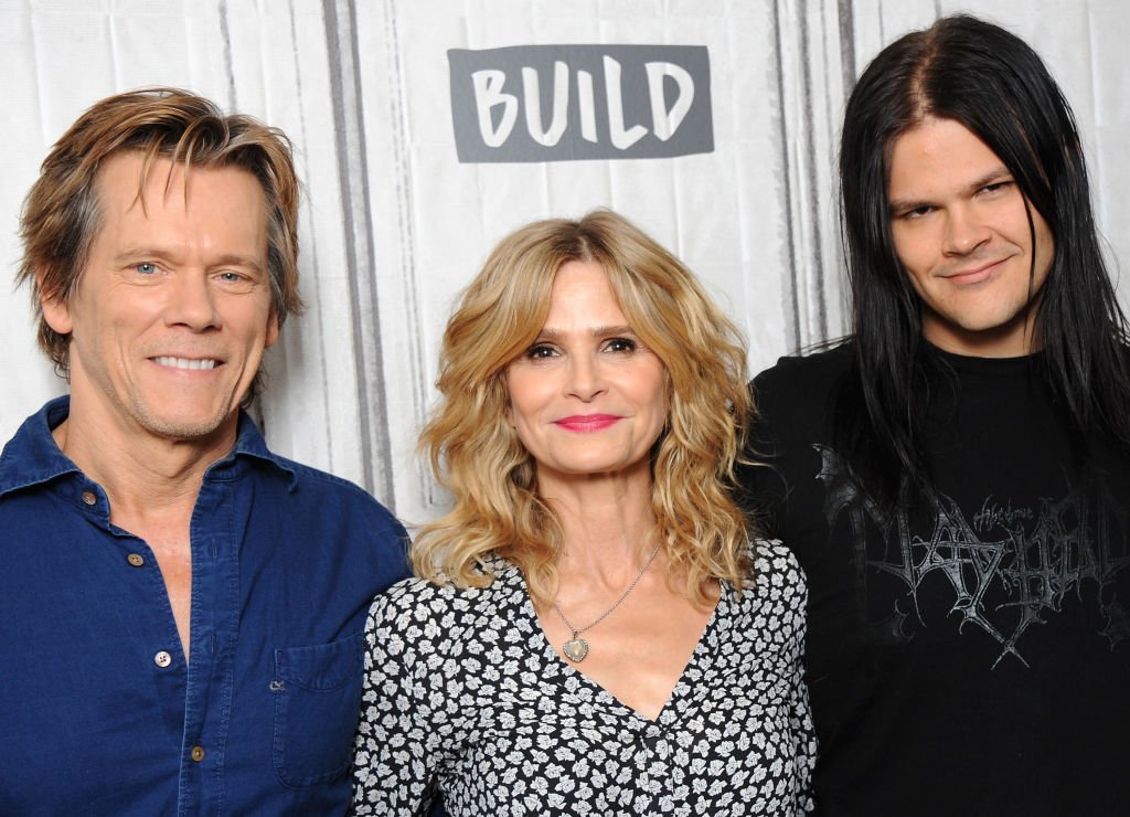 Travis Bacon junto a sus padres.| Foto: Getty Images.