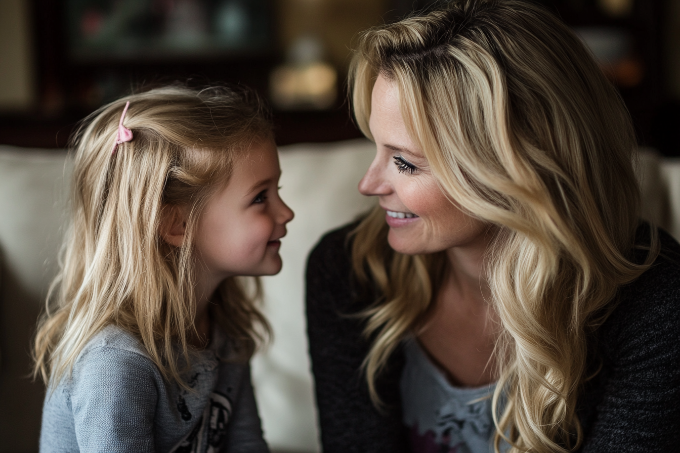 Una mujer sonriendo a su hija | Fuente: Midjourney