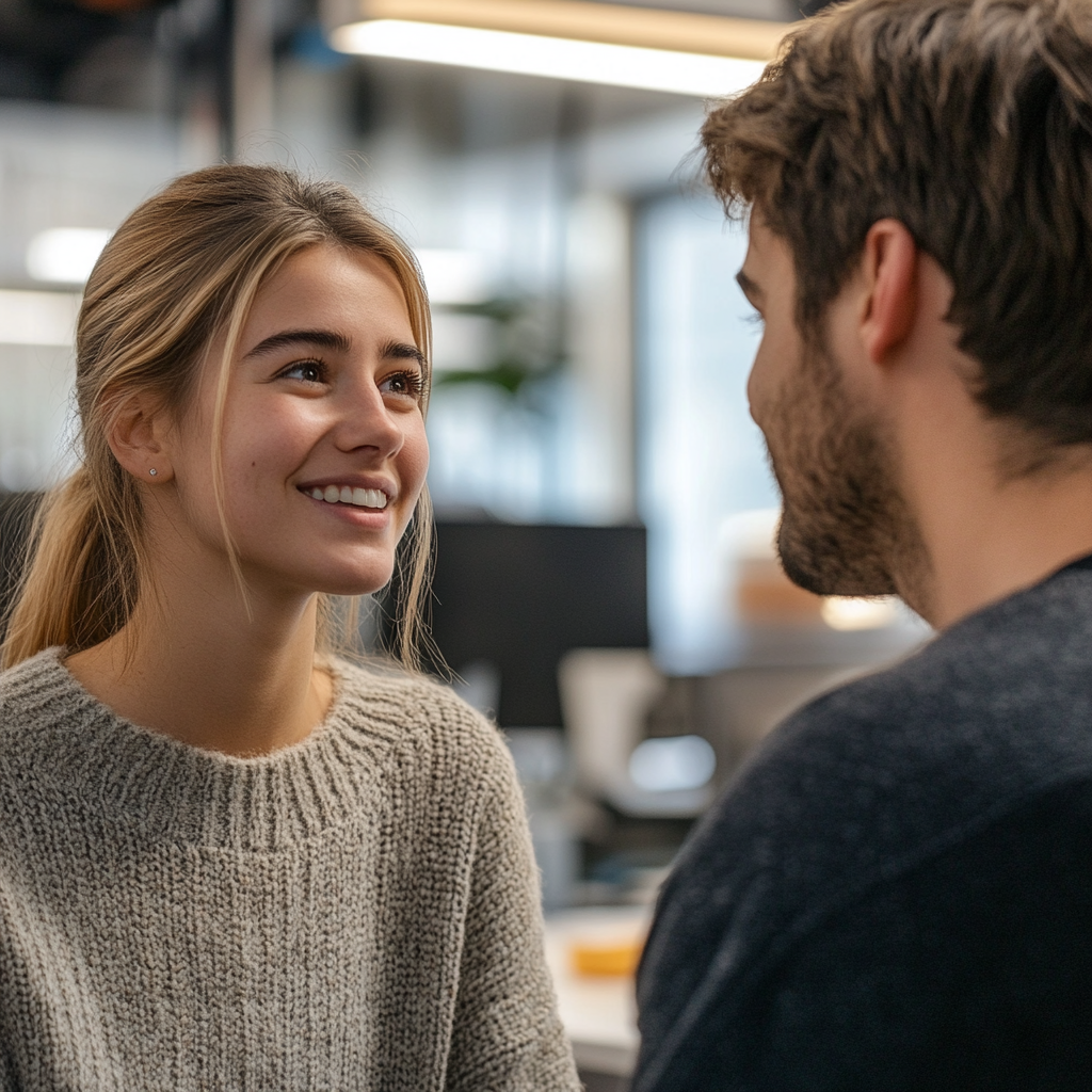 Una joven sonriente mirando a un técnico de laboratorio | Fuente: Midjourney