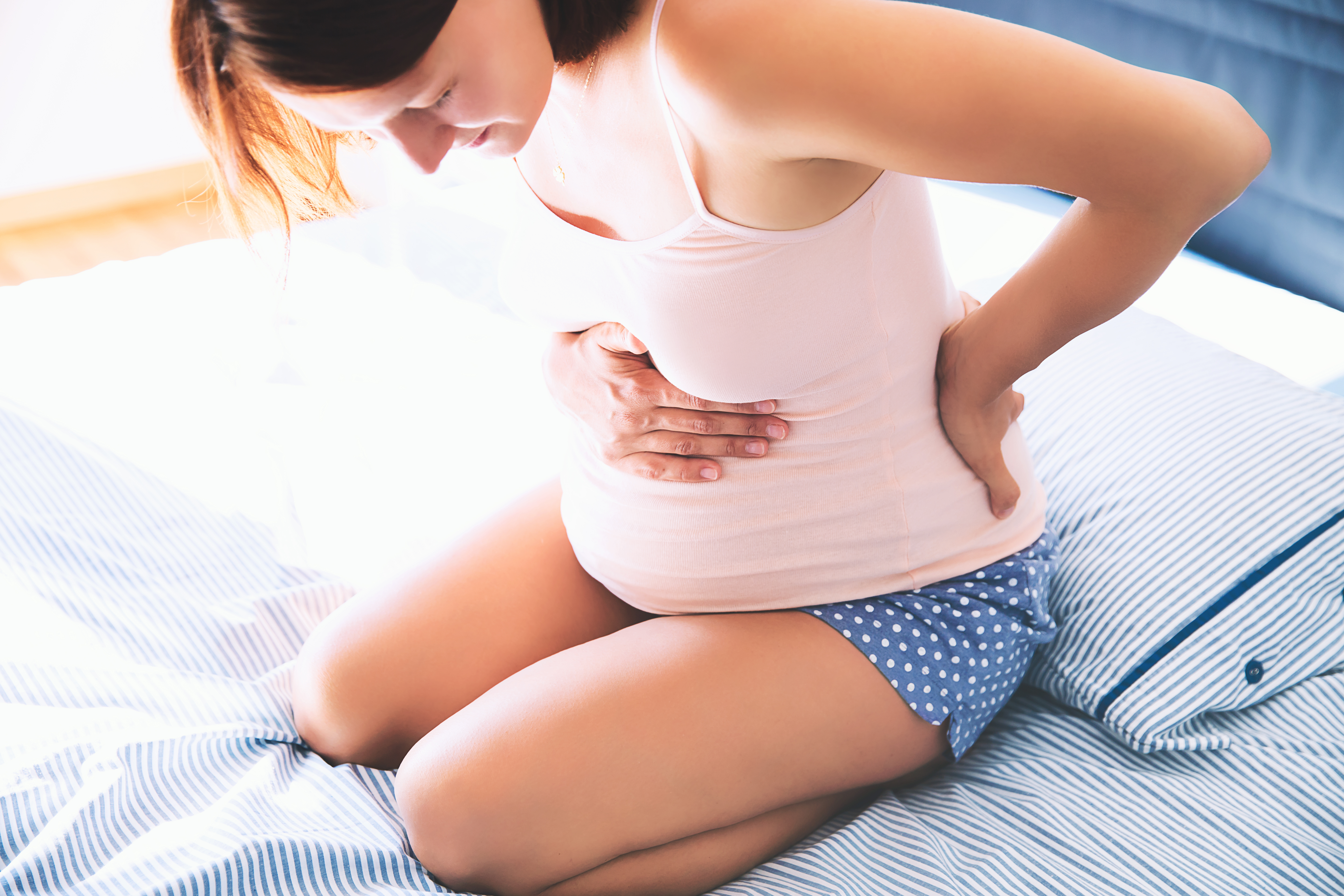 Mujer embarazada con dolor | Foto: Shutterstock