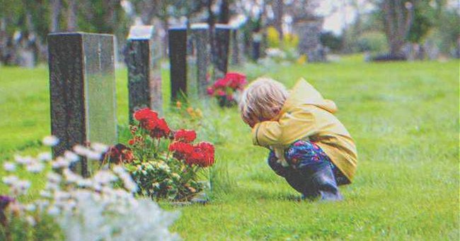 Un niño frente a una tumba | Foto: Shutterstock