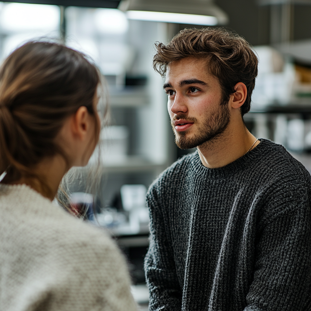 Un trabajador de laboratorio hablando con una mujer | Fuente: Midjourney