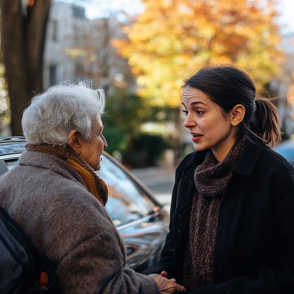 Mujer mayor hablando con una mujer de mediana edad | Fuente: Midjourney