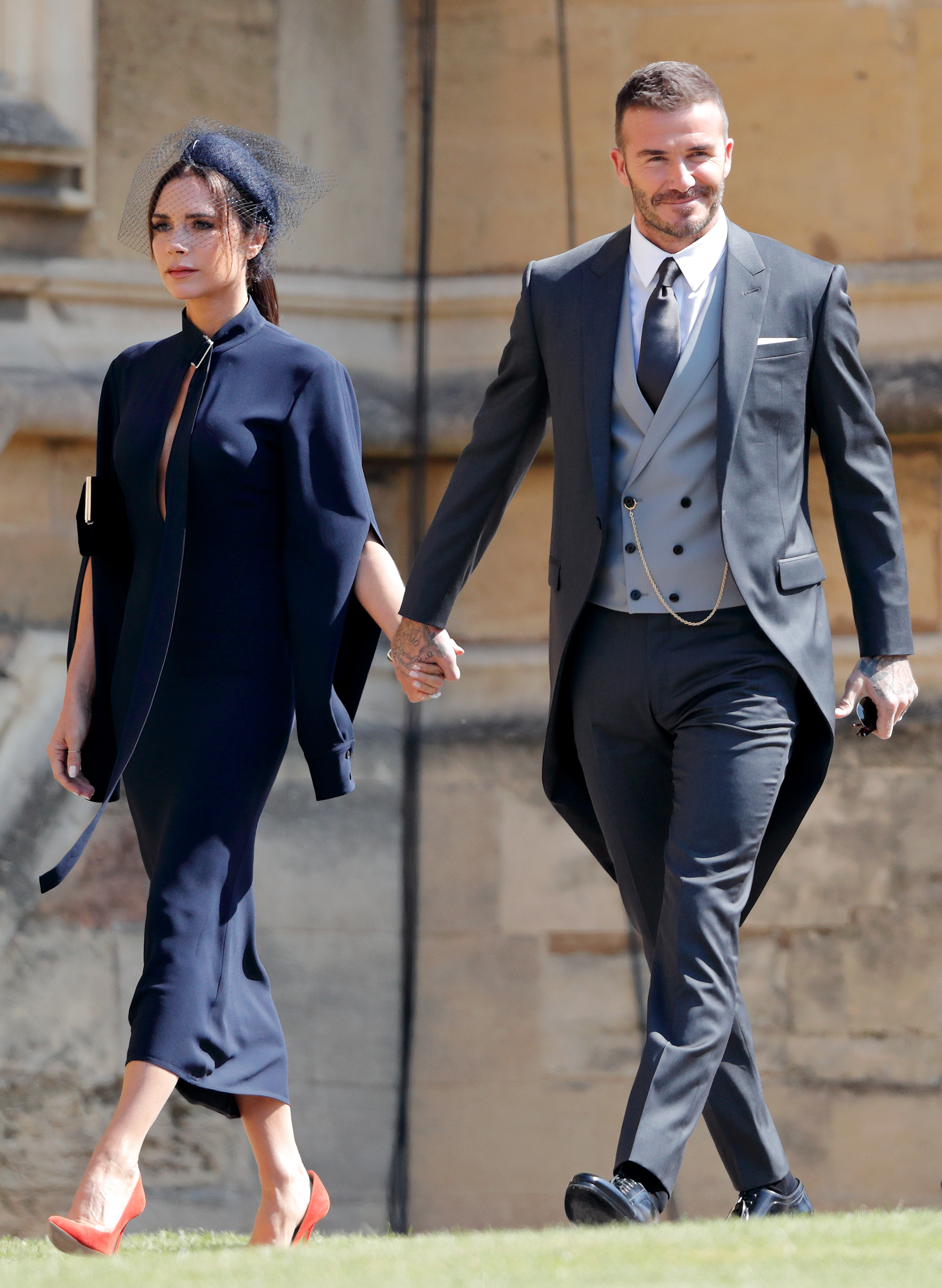 Victoria y David Beckham asisten a la boda del príncipe Harry con Meghan Markle en la capilla de San Jorge, en el castillo de Windsor, el 19 de mayo de 2018, en Windsor, Inglaterra | Foto: Getty Images