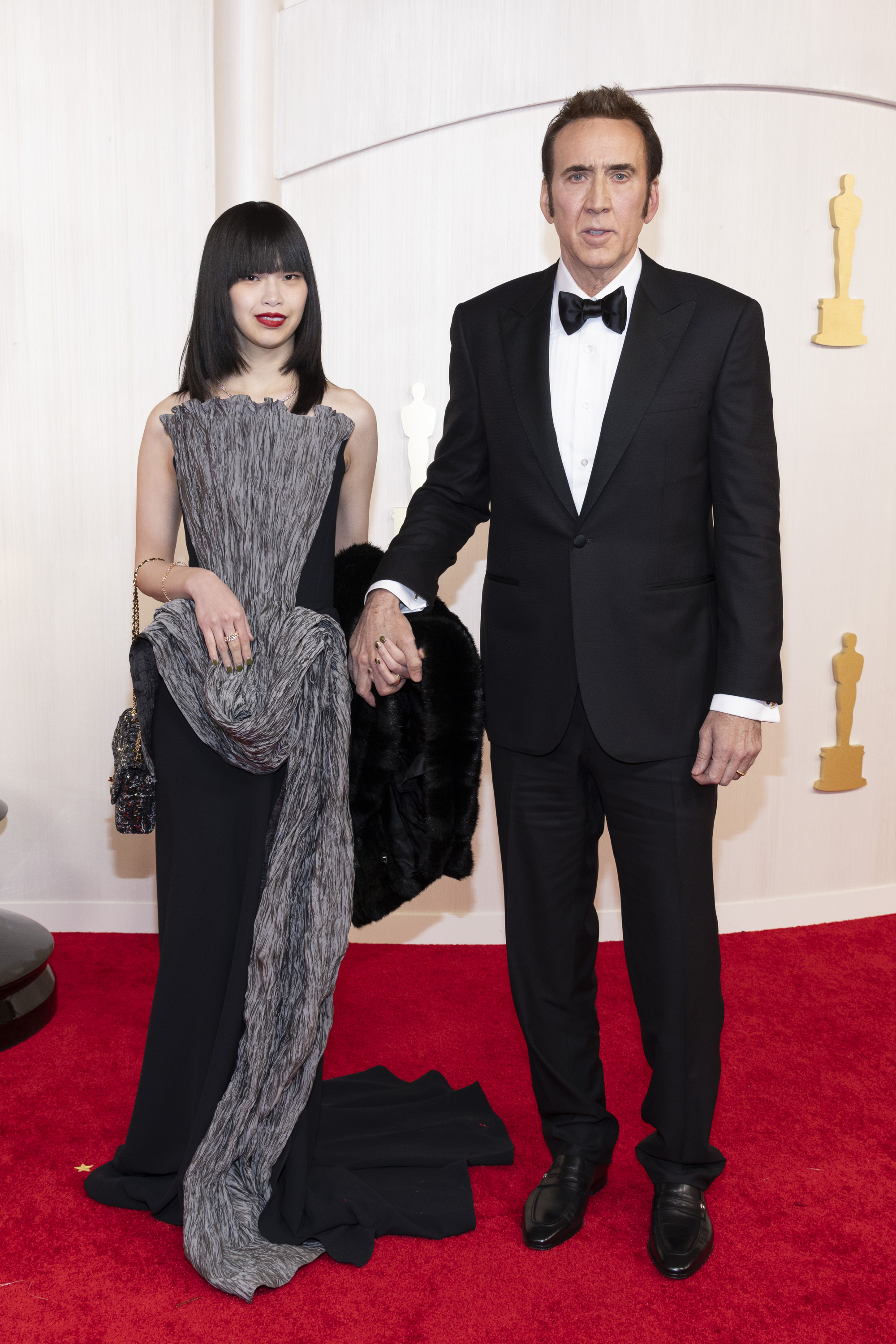 Riko Shibata y Nicolas Cage en la 96ª edición de los Oscar el 10 de marzo de 2024. | Fuente: Getty Images
