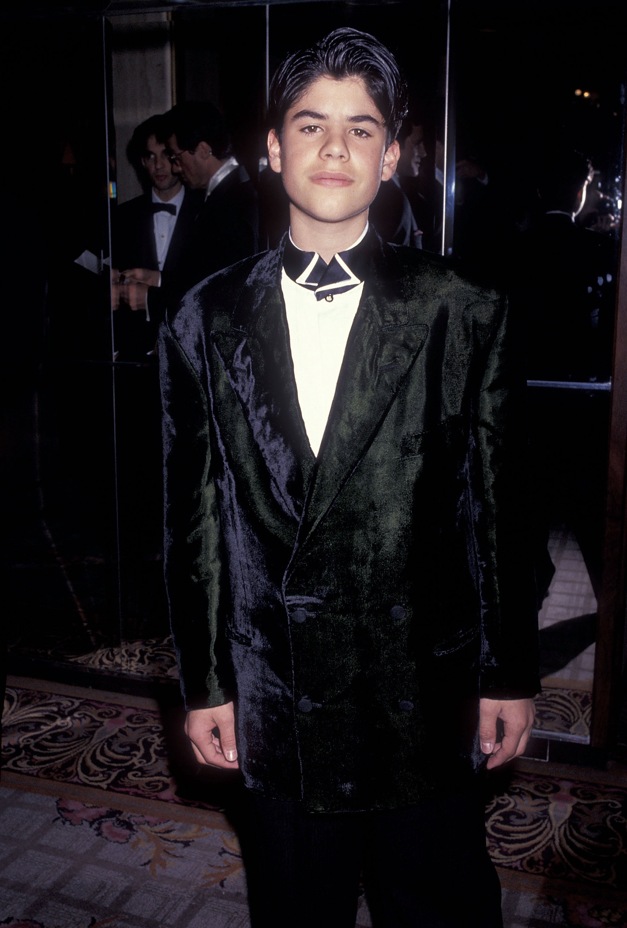 Sage Stallone en el Quinto Desfile Anual de Moda y Cena a Beneficio de Gianni Versace patrocinado por la Industria de la Moda de California Amigos del Proyecto SIDA Los Angeles en Century City, California, el 13 de febrero de 1991. | Foto: Getty Images