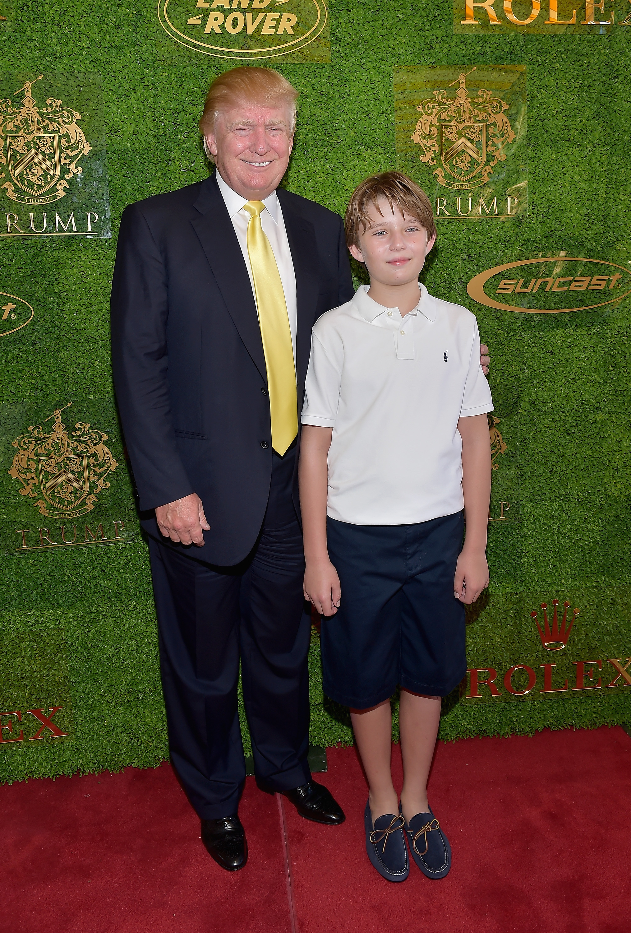 Donald y Barron Trump en el Trump Invitational Grand Prix en The Mar-a-Lago Club el 4 de enero de 2015, en Palm Beach, Florida. | Fuente: Getty Images