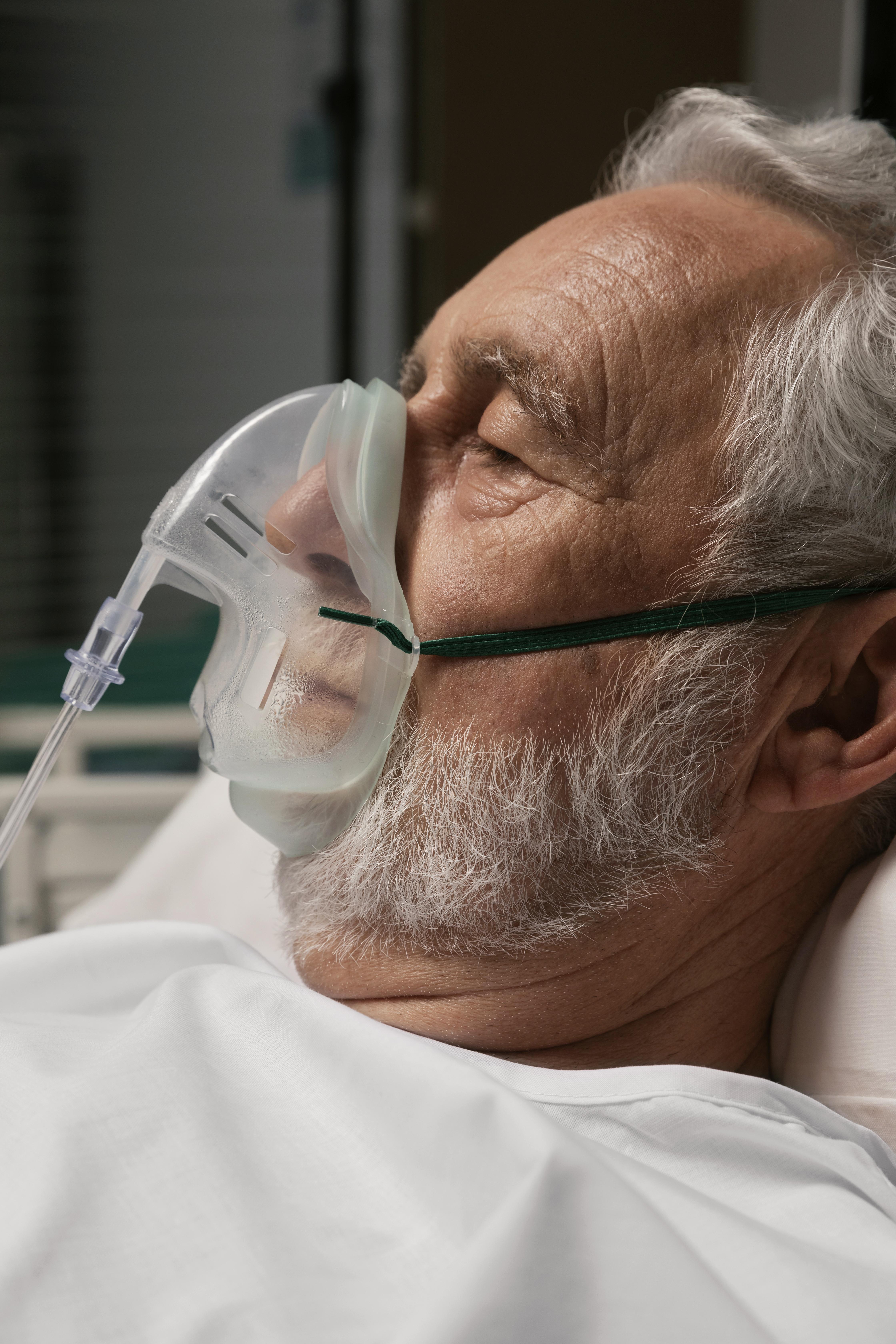 An elderly man in a hospital bed | Source: Freepik