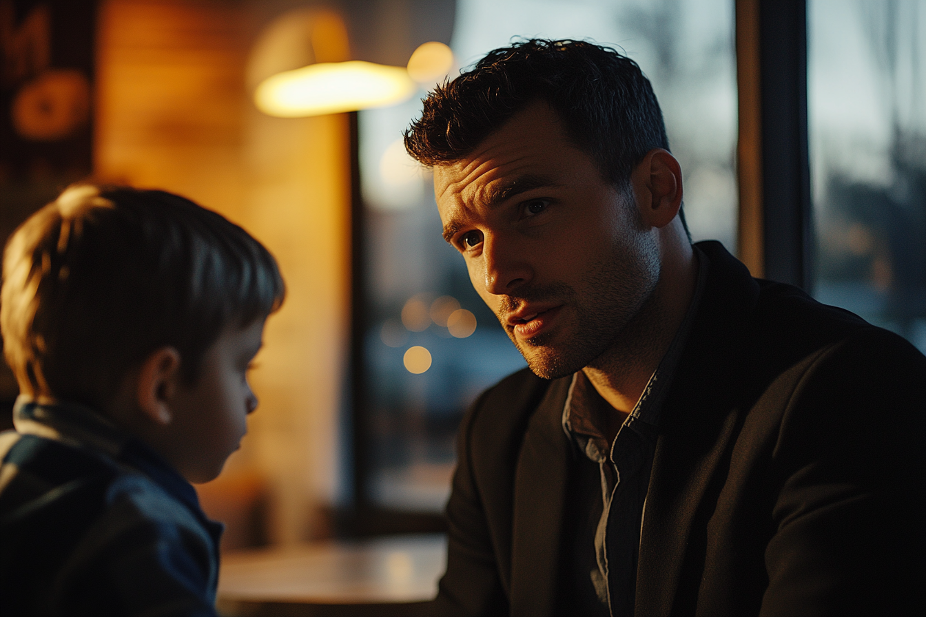 Un hombre hablando con un niño | Fuente: Midjourney