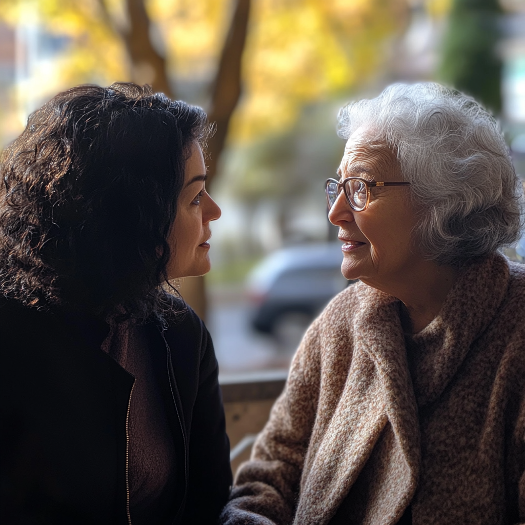 Mujeres manteniendo una conversación | Fuente: Midjourney