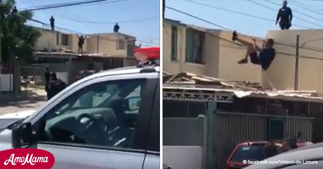 Supuesto ladrón intenta escapar de la policía, y termina colgando de un cable (Video)