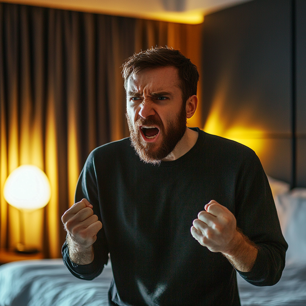 Un hombre enfadado hablando en una habitación de hotel | Fuente: Midjourney