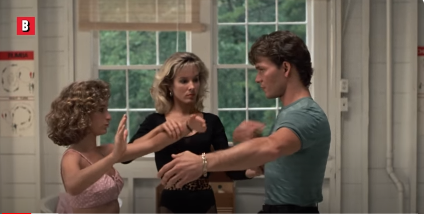 Cynthia Rhodes y otros actores en una escena de "Dirty Dancing". | Fuente: YouTube/BoxofficeMoviesScenes
